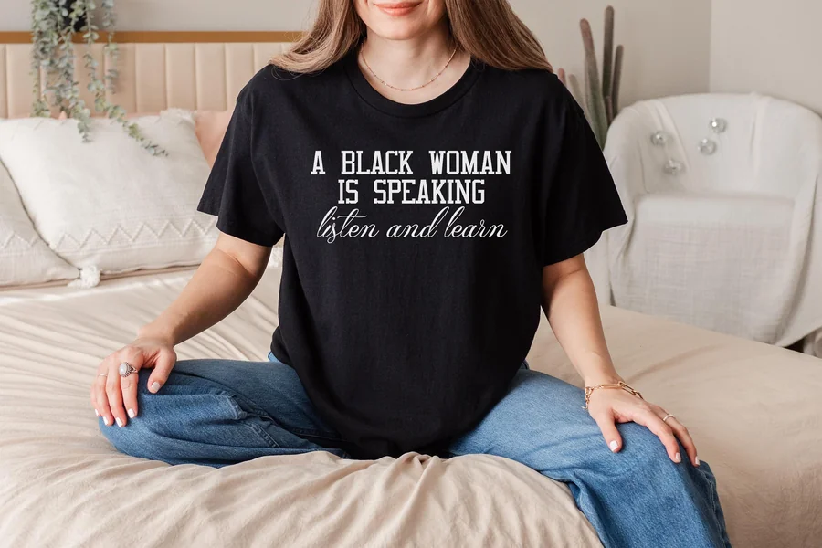 a black woman is speaking listen and learn shirt